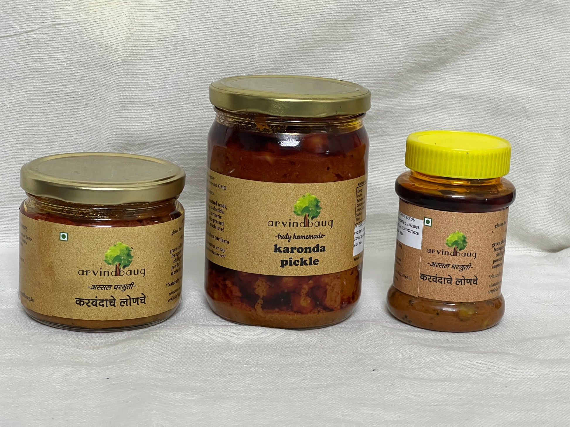 200 g, 250 g, and 500 g jars of Arvindbaug karonda pickle.